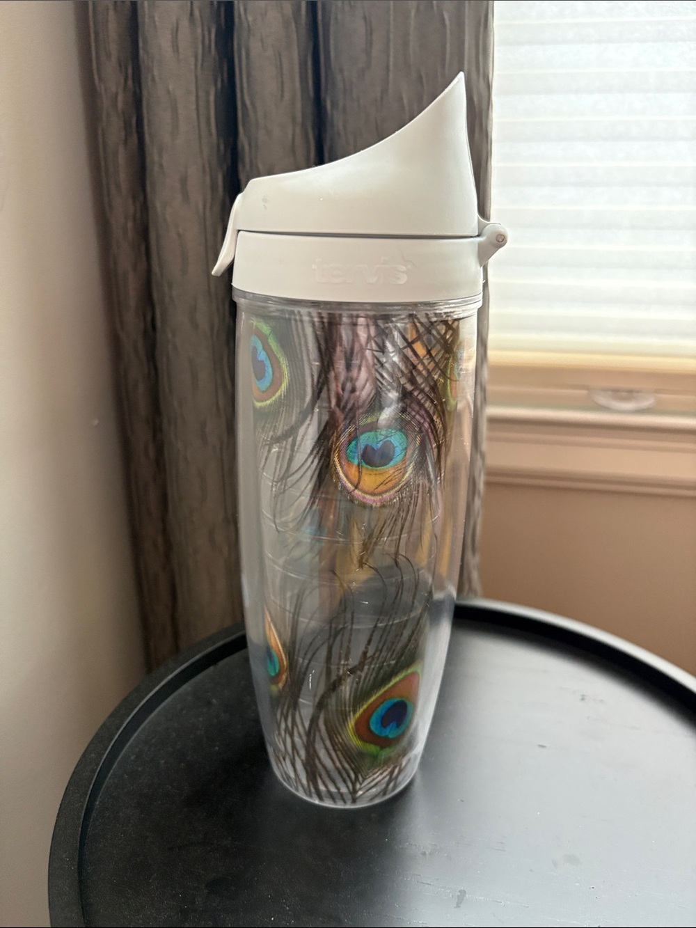24 oz Tervis white travel tumbler with peacock feather motif
